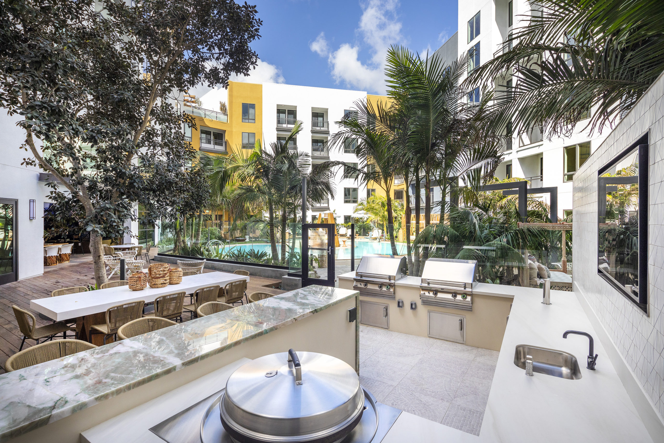 resort pool and outdoor kitchen barbecue broadstone atlas apartments